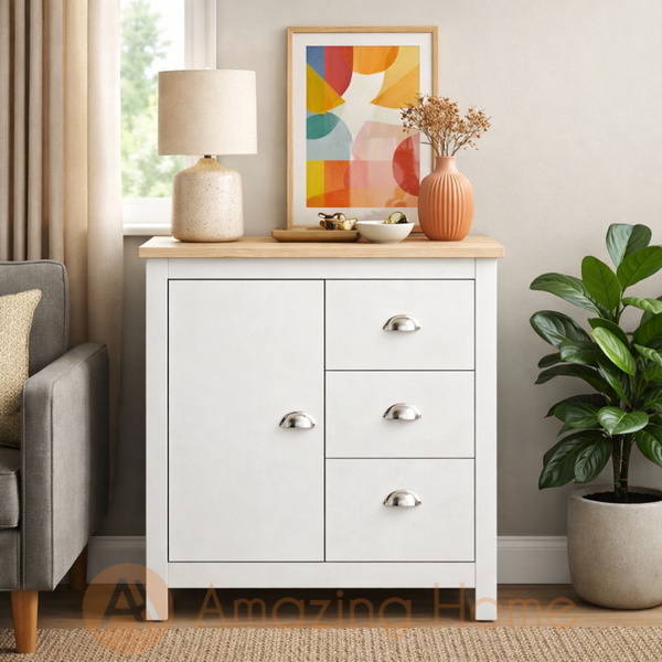 Modern white storage cabinet with wood top placed in a living room near window, styled with decorative accessories.